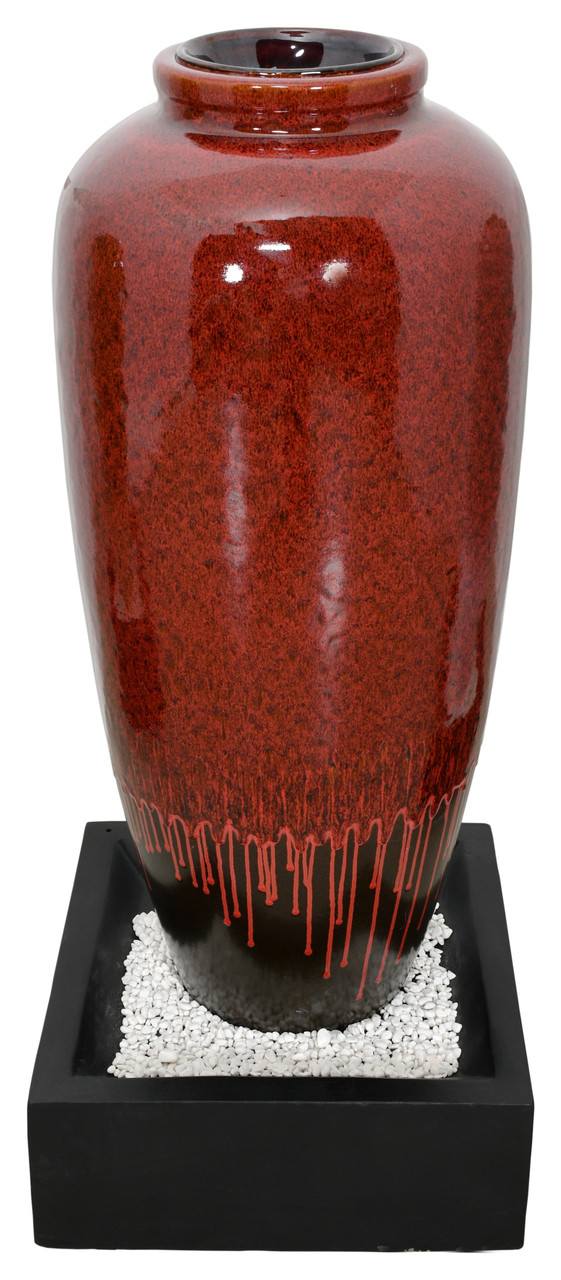 Red Bubbling Fountain With Base Close Up Image