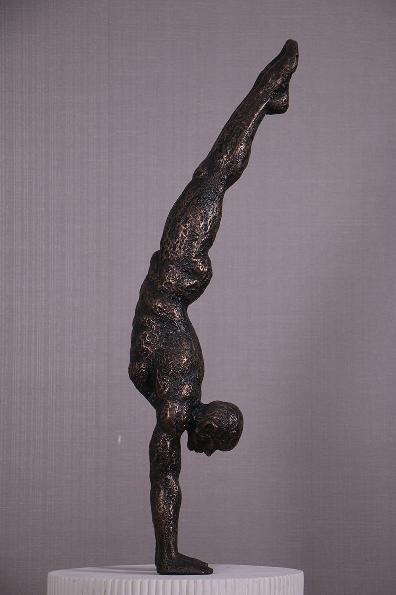 Handstand Sculpture on Pedestal Close Up Image